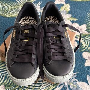 Puma Basket Navy and Light Blue Sneakers with Gold Accents.